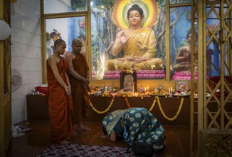 Devotees pray to Lord Buddha on the occasion of Buddha Purnima or Vesak Day that commemorates
