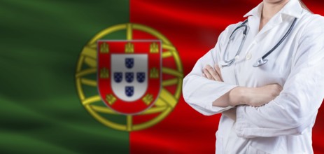 Doctor with crossed arms on Portugal flag. Portugal health and care concept. Female doctor on