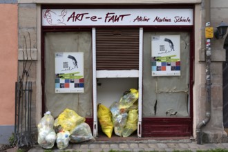 Yellow bags in front of the entrance to an art studio, Bavaria, Germany, Europe