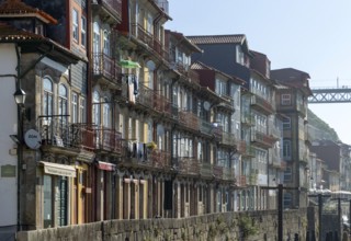Historic buildings with balconies on waterfront of Ribeira district, city of Porto, Portugal,