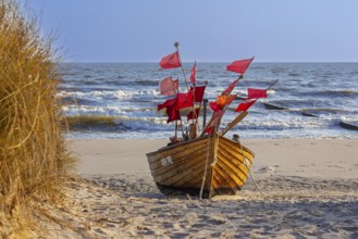 Traditional wooden fishing boat on the beach along the Baltic Sea at Stubbenfelde, Loddin on the