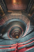 Vertical view from above through a spiral staircase in a building called Sprinkenhof, Hamburg,