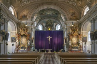 Interior with large purple Lenten cloth in front of the high altar, baroque parish church of St