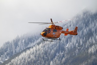 Rescue helicopter, emergency helicopter in flight, Schwaz, Tyrol, Austria, Europe