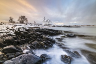 Gimsøy church in front of snow-covered mountains, Gimsoykirke, Gimsoy, Lofoten, Norway, Europe