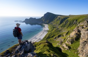 Mountaineer in front of view of coastal landscape, steep coast with summit Måtind or Måtinden,