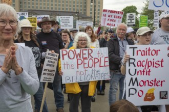 Detroit, Michigan - Labor organizations protest President Trump's 'war on working people' with a