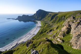 View of coastal landscape, cliffs with peak Måtind or Måtinden, Høyvika beach and sea, hike to the