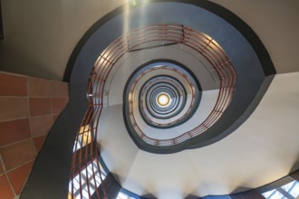 View from below through a spiral staircase with red banisters, SPRINKENHOF, Hamburg, Germany,
