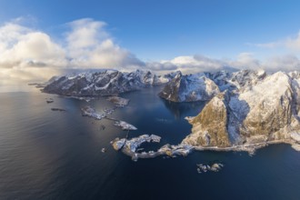 View of islands, fjord and mountains, snowy landscape, fishing villages Hamnøy, Sakrisøy and Reine,