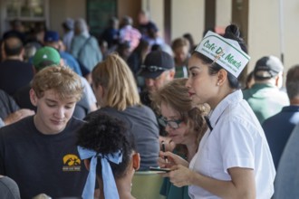 New Orleans, Louisiana - A server takes orders at Cafe du Monde. The coffee shop in the French