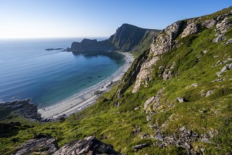 View of coastal landscape, cliffs with peak Måtind or Måtinden, Høyvika beach and sea, hike to the