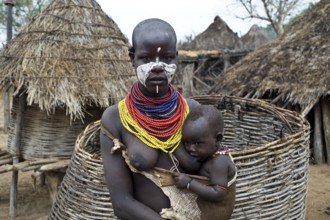 Portrait of a young mother and child from the Karo tribe, Omo valley, Ethiopia, Africa