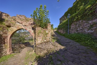 Dilapidated walls and old wrought-iron gate on the Schlossgasse in Miltenberg, Lower Franconia,