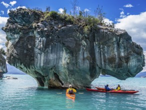 Paddling tourist in kajak at the marmor caves near Puerto Rio Tranquilo, a village at the Carretera