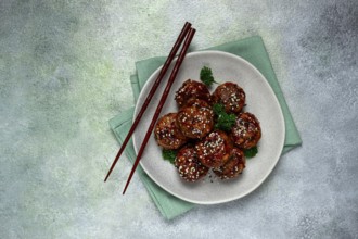 Tsukune, Japanese meatballs, minced chicken, fried on a skewer, with yakitori sauce, homemade, no
