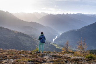 Hiker on the Venet, Upper Inn Valley in the morning light, view from Venet, Ötztal Alps, Tyrol,