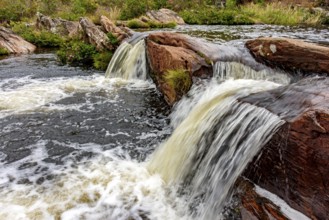 Rocks and vegetation in the river in the Biribiri mountain range in Diamantina, Minas Gerais,