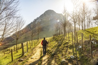 A man climbing the trek up Mount Ernio or Hernio in Gipuzkoa, Basque Country