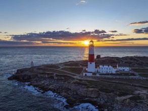 Sunset over Portland Bill Lighthouse from a drone, Portland Bill, Isle of Portland, Dorset,