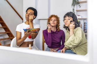 View from a mirror of non binary and gay friends making up at home