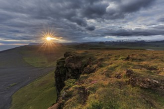 Sunset on cliffs, cloudy mood, summer, Dyrholaey, Iceland, Europe