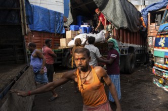 GUWAHATI, INDIA - MAY 1: Labourers carries goods in a wholesale market, in Guwahati, India, on May