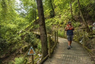 A male hiker on a mountain trail in the Borce commune of the French Pyrenees