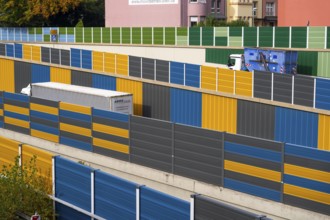 Colourful noise barriers on the A52 motorway, at the Essen-Rüttenscheid junction, the noise