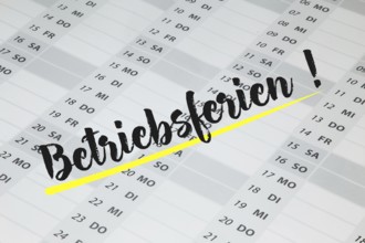 The word BETRIEBSFERIEN is written in large letters on a calendar (symbolic image)