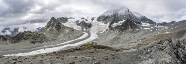 Panorama mountain hut Cabane des Dix in front of glacier Glacier de Cheilon and summit Mont Blanc