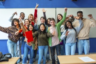 Multi ethnic university students celebrating their academic achievements inside classroom