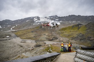 Air rescue operations in the mountains, rescue helicopter, Valais, Switzerland, Europe