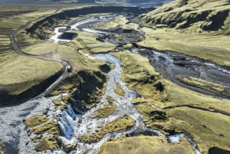 Road F232 Öldufellsleid, along northern slopes of glacier Myrdalsjökull, moss-covered hills in