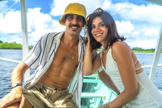 Tourists relaxing on a boat trip in siargao island, philippines, enjoying summer holidays and