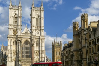 Towers and frontage of Westminster abbey church with Victoria Tower in background, Westminster,