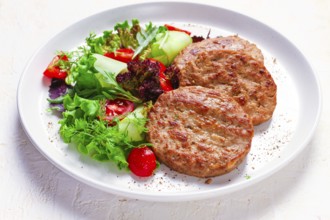 Fried cutlets, turkey, with vegetable salad, top view, no people