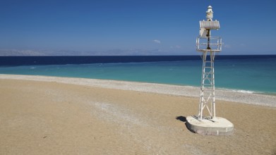 Northern tip of Rhodes, isolated lighthouse on sandy beach with wide sea view, harbour area, Rhodes