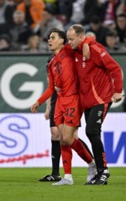 Jamal Musiala FC Bayern Munich FCB (42) injured Injury is escorted off the pitch by the attendants