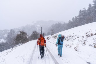 A couple of skiers on Mount Aizkorri in Gipuzkoa. Snowy landscape by winter snows. Basque Country,