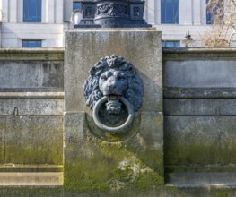Bronze Lion head mooring ring on the Bazalgette Embankment, Westminster, London, England, UK