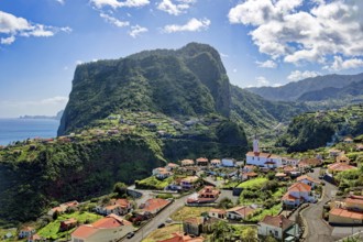 The village of Faial with a view of the landmark Eagle Rock from the Miradouro do Fortim viewpoint,