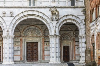 Arched entrance portals of the Cathedral of San Martino, historic city centre, Lucca, Tuscany,