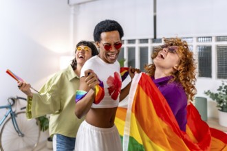 Happy multiracial and gender diverse lgbt people dancing an partying at home