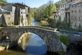 Olliergues village. Old bridge on river Dore. Natural regional park of Livradois Forez. Puy de Dome
