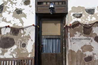 Fishing nets on house wall, facade with door, cottage, Arrieta, Haria, Lanzarote