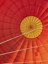 Hot air balloon inside view, top opens to release warm air before landing. Hot air balloon ride
