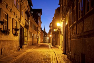 Half-timbered houses in a narrow street with cobblestones, Old Town in the evening, World Heritage