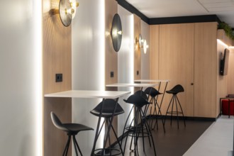Modern airport workspace offering travelers a stylish area to work or relax, featuring sleek
