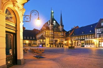 Market square with atmospherically illuminated town hall in the evening, Wernigerode, Harz,